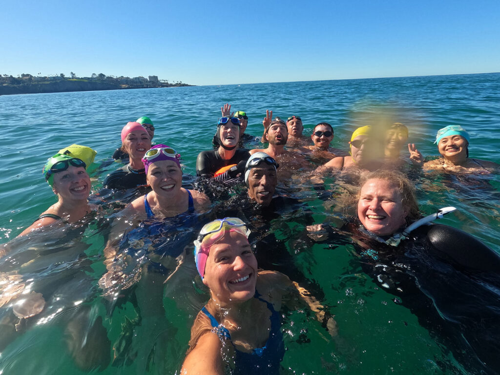 Swimmers participating 2023 Polar Plunge Reboot selfie photo in water